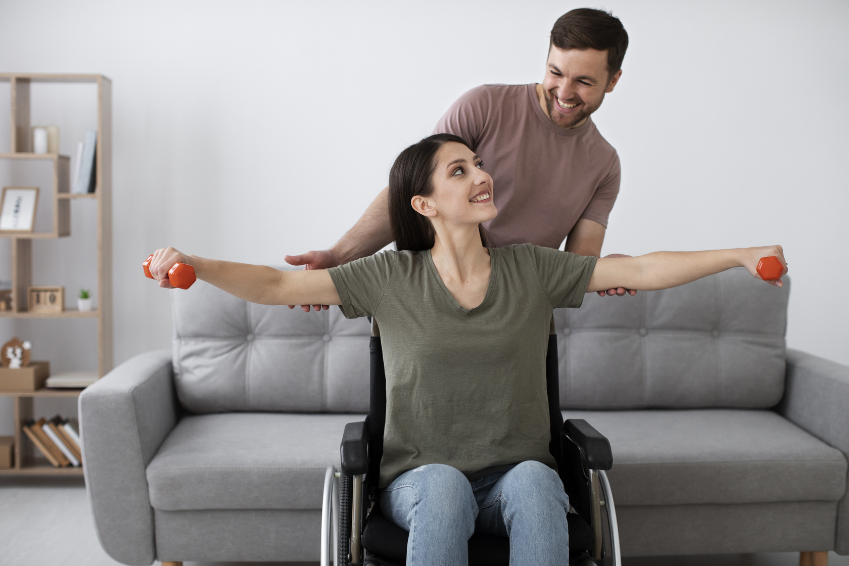 young adult helping disabled friend at Core Concept