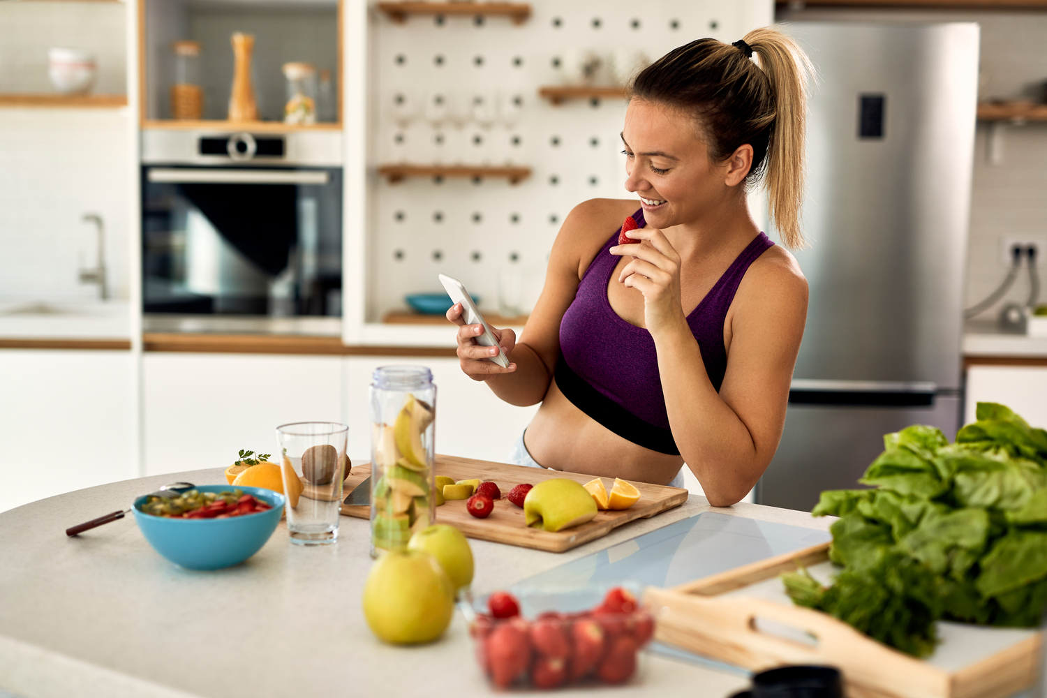 young happy athletic woman eating at Core Concept